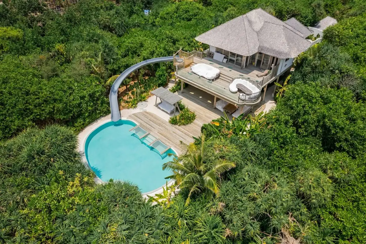 Overwater bungalow at sunset